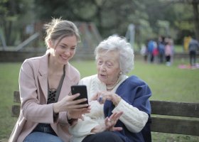 young woman and older woman consulting information together